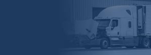 Broken down semi truck with hood open getting serviced at mechanic facility