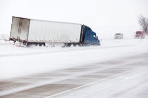 A truck driver ensuring safety around his truck