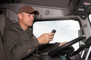 a truck driver texting while driving