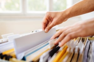 someone shuffling through a collection of files