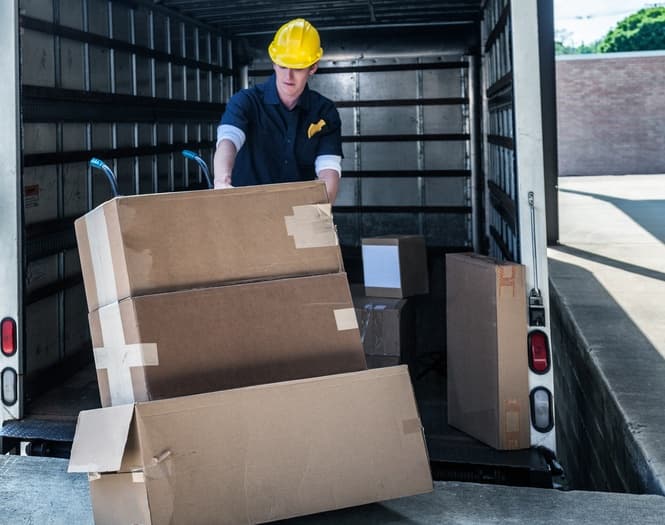 Man moving cardboard boxes