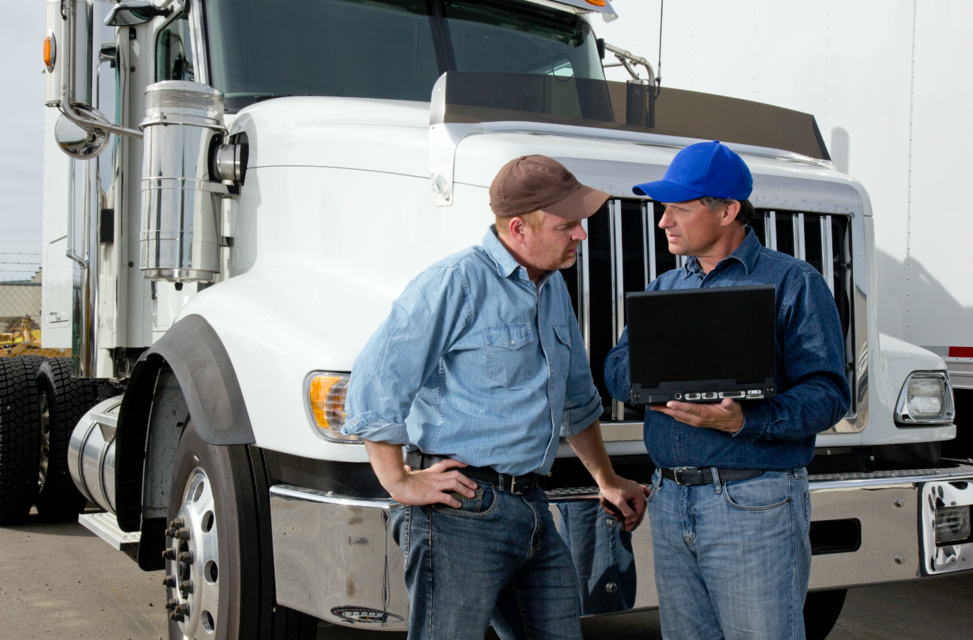 Two men truck drivers talking