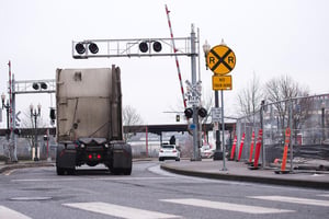 a semi crossing railroad tracks