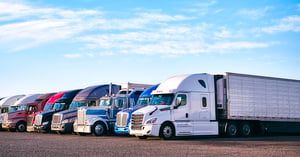 fleet of trucks parked in a parking lot