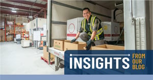 Smiling worker unloading trailer